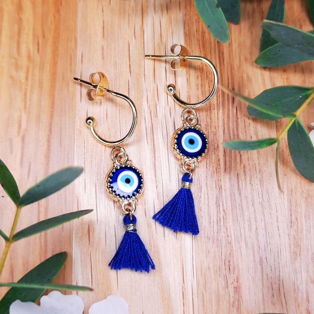 Midnight blue evil eye tassel earrings