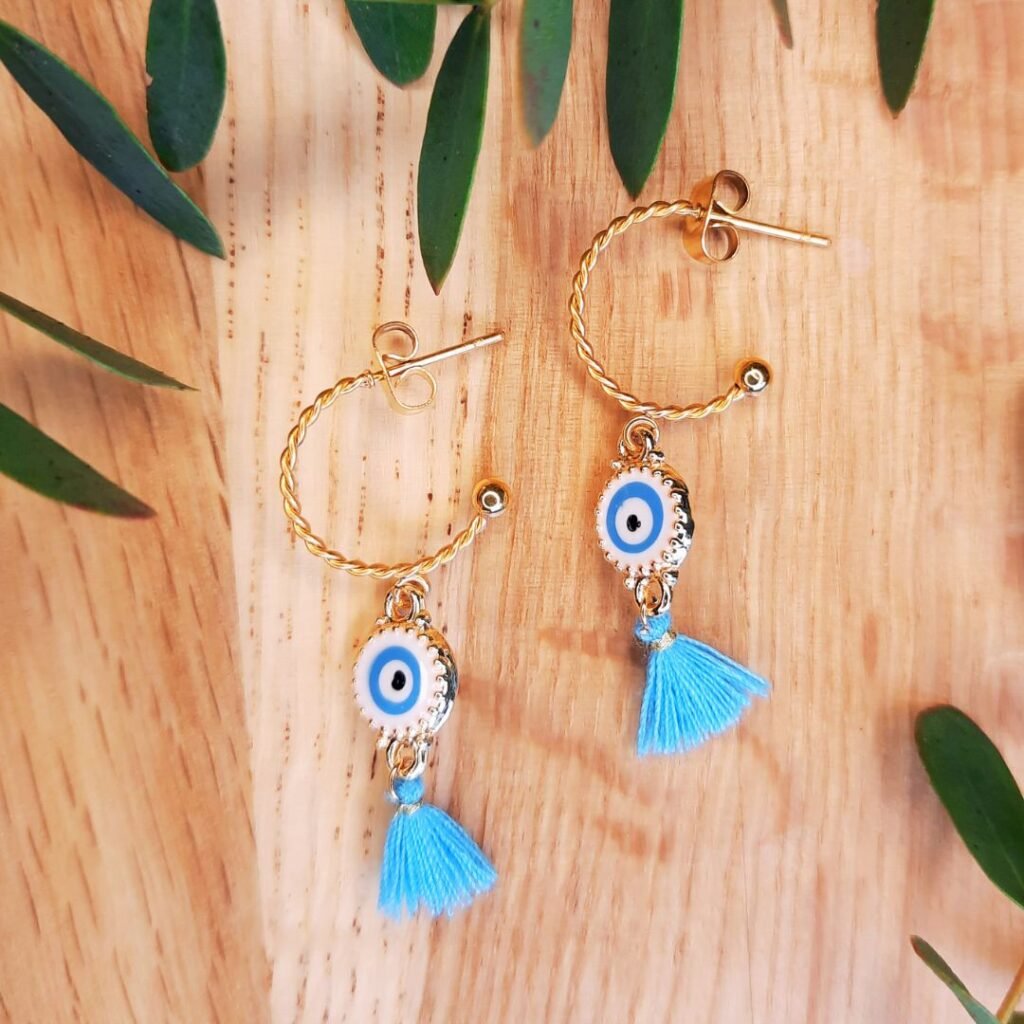 Sky blue evil eye tassel earrings